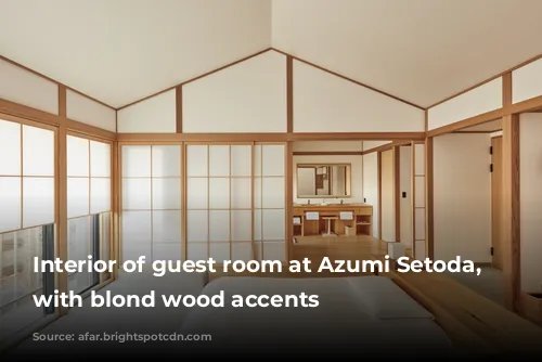 Interior of guest room at Azumi Setoda, white with blond wood accents