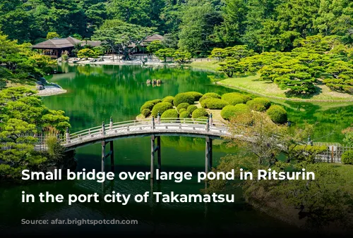 Small bridge over large pond in Ritsurin Garden in the port city of Takamatsu