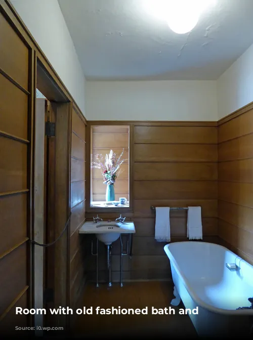 Room with old fashioned bath and washbasin