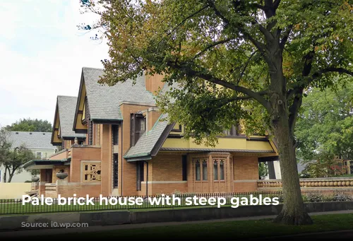 Pale brick house with steep gables