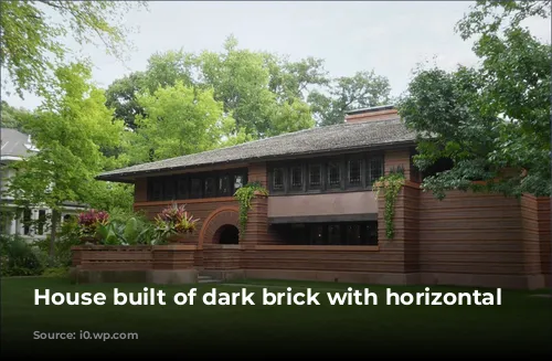 House built of dark brick with horizontal lines