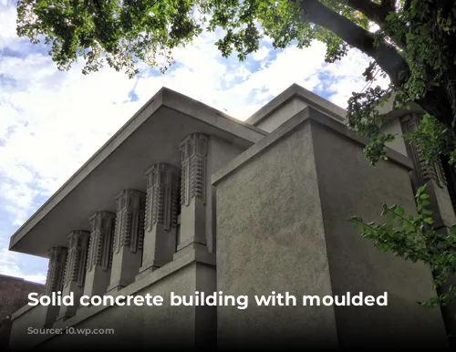 Solid concrete building with moulded decorations