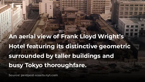 An aerial view of Frank Lloyd Wright’s Imperial Hotel featuring its distinctive geometric design, surrounded by taller buildings and a busy Tokyo thoroughfare.
