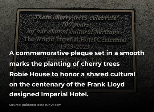 A commemorative plaque set in a smooth rock marks the planting of cherry trees at Robie House to honor a shared cultural heritage on the centenary of the Frank Lloyd Wright designed Imperial Hotel.
