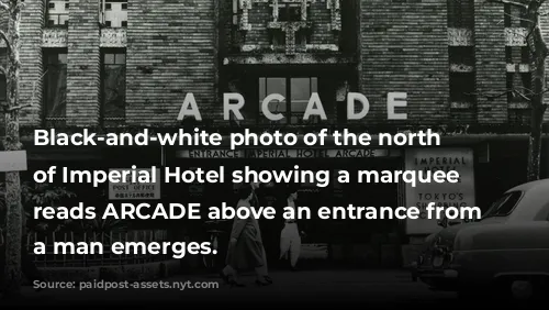 Black-and-white photo of the north facade of Imperial Hotel showing a marquee that reads ARCADE above an entrance from which a man emerges. 
