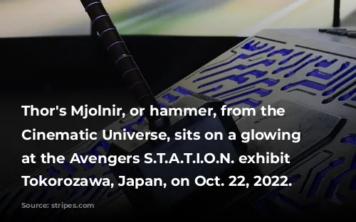 Thor's Mjolnir, or hammer, from the Marvel Cinematic Universe, sits on a glowing display at the Avengers S.T.A.T.I.O.N. exhibit in Tokorozawa, Japan, on Oct. 22, 2022.