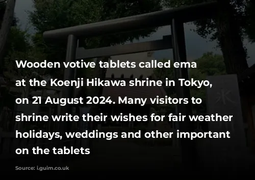 Wooden votive tablets called ema hang at the Koenji Hikawa shrine in Tokyo, Japan, on 21 August 2024. Many visitors to the shrine write their wishes for fair weather during holidays, weddings and other important events on the tablets