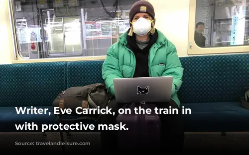 Writer, Eve Carrick, on the train in Tokyo with protective mask.