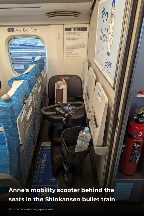 Anne's mobility scooter behind the last seats in the Shinkansen bullet train carriage