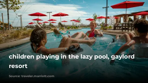 children playing in the lazy pool, gaylord rockies resort