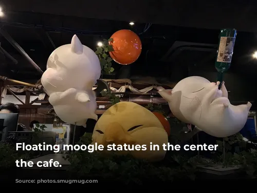 Floating moogle statues in the center of the cafe.