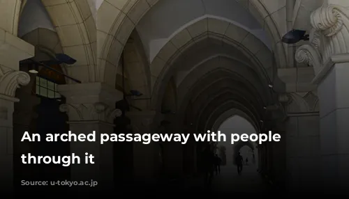 An arched passageway with people walking through it