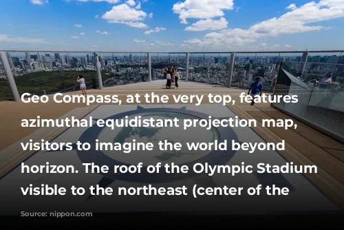 Geo Compass, at the very top, features an azimuthal equidistant projection map, prompting visitors to imagine the world beyond the horizon. The roof of the Olympic Stadium is visible to the northeast (center of the photo).