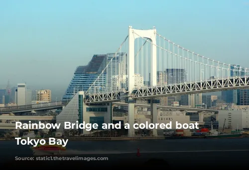 Rainbow Bridge and a colored boat on Tokyo Bay 