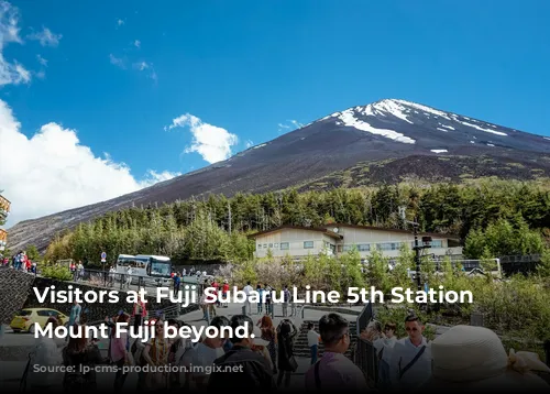 Visitors at Fuji Subaru Line 5th Station with Mount Fuji beyond.