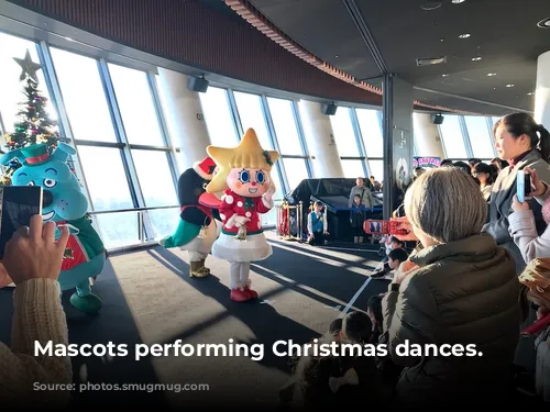 Mascots performing Christmas dances.