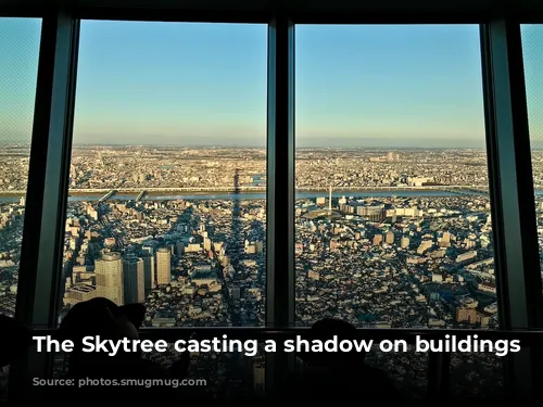 The Skytree casting a shadow on buildings below.